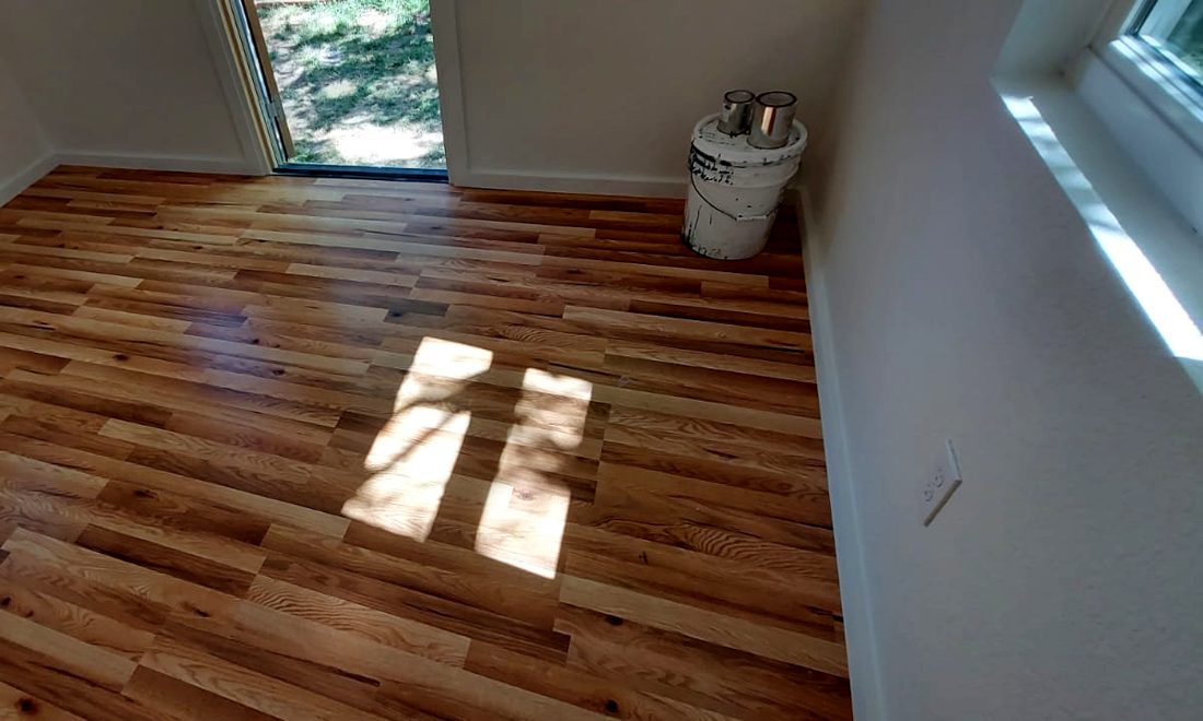 Natural hardwood floor in a finished studio