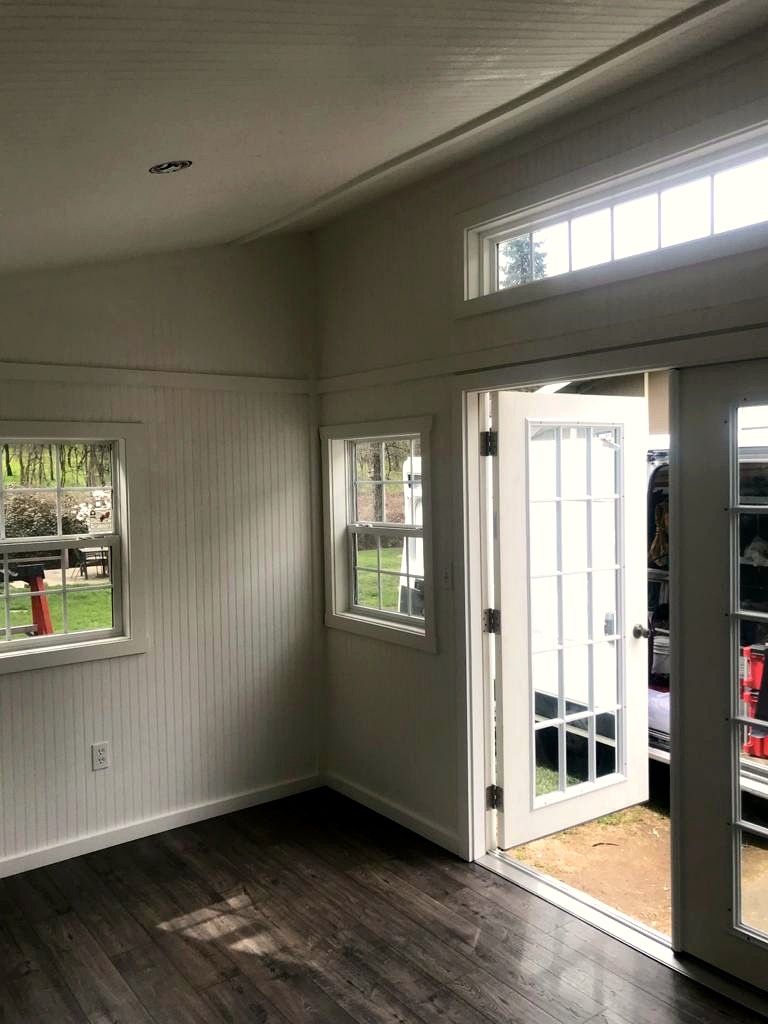 Studio with French doors, transom window and beadboard walls